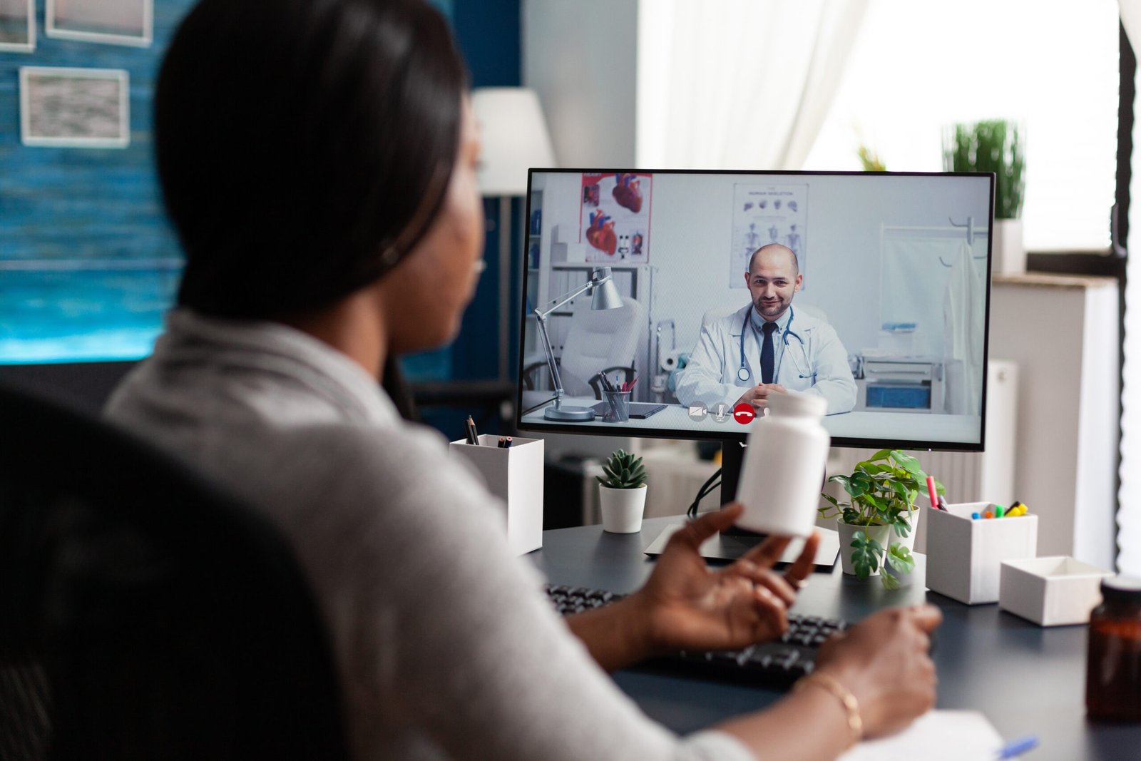 African american patient discussing with therapist doctor during online videocall meeting conference appointment. Physician explaining pills treatment discussing sickness diagnosis